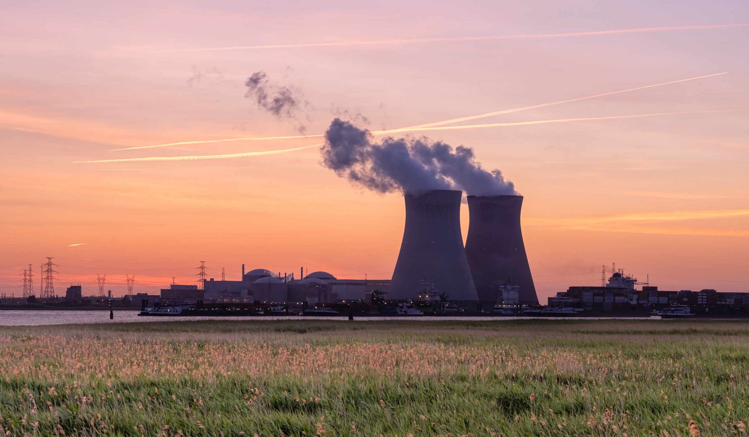 Nuclear power plant with sunset in the background